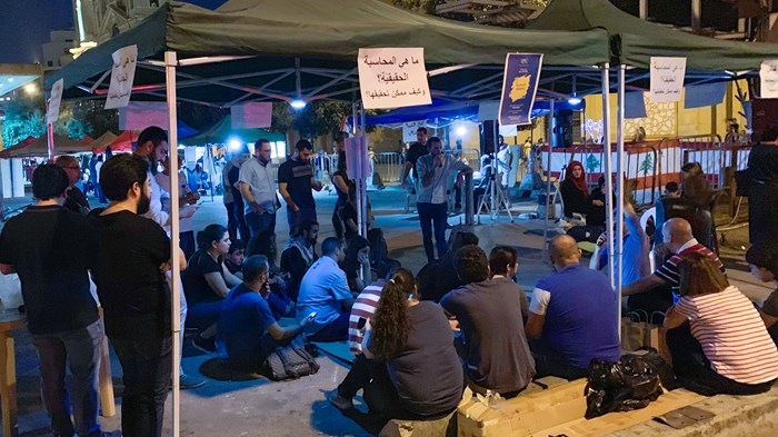 Christians from Ras Beirut Baptist Church host discussions at the protest site.