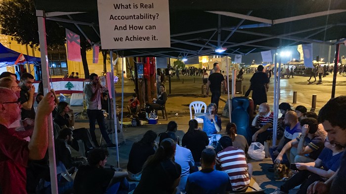 Christians from Ras Beirut Baptist Church host discussions at the protest site.