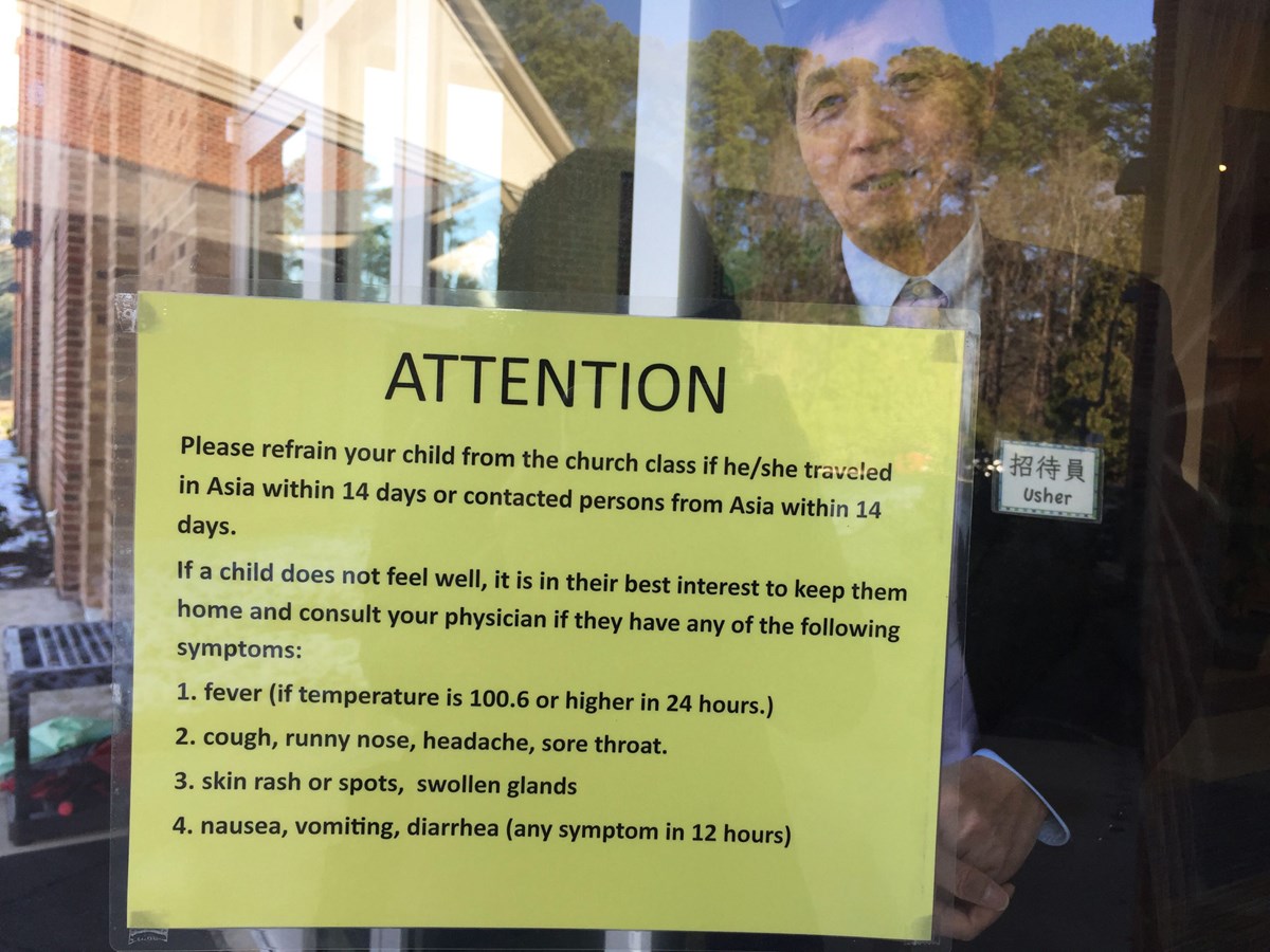 The sign outside Raleigh Chinese Christian Church warns parents not to bring their children to church if they traveled to Asia in the past two weeks.