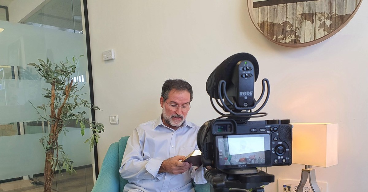 Avi Mizrachi, a Shelanu board member and a native-born Israel Messianic leader, reads to camera. Avi Mizrachi, a Shelanu board member and a native-born Israel Messianic leader, reads to camera.