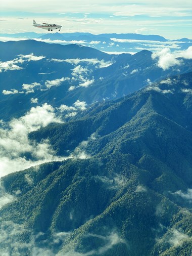 An MAF plane flies to Mamit in the mountainous interior of Papua. An MAF plane flies to Mamit in the mountainous interior of Papua.