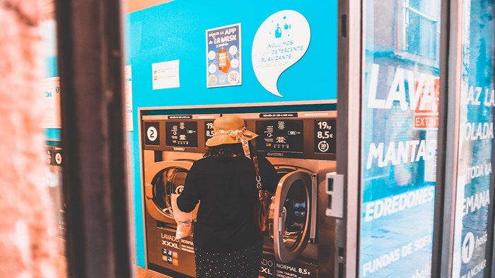THE WOMAN AT THE LAUNDROMAT THE WOMAN AT THE LAUNDROMAT