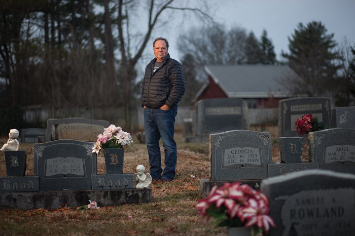 Bryan Smith stands among the gravestones where he often prayed for New Victory.