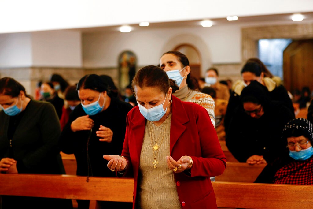 Iraqi Christians attend a mass in a church in Qaraqosh, Iraq, on February 22.