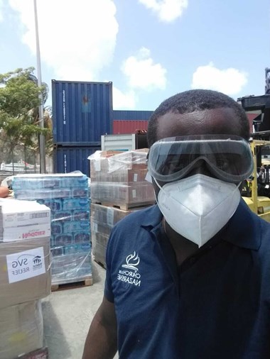 Kelron Harry receives a shipment of donations from Nazarene Compassionate Ministries and the Trinidad and Tobago Nazarene district. Kelron Harry receives a shipment of donations from Nazarene Compassionate Ministries and the Trinidad and Tobago Nazarene district.