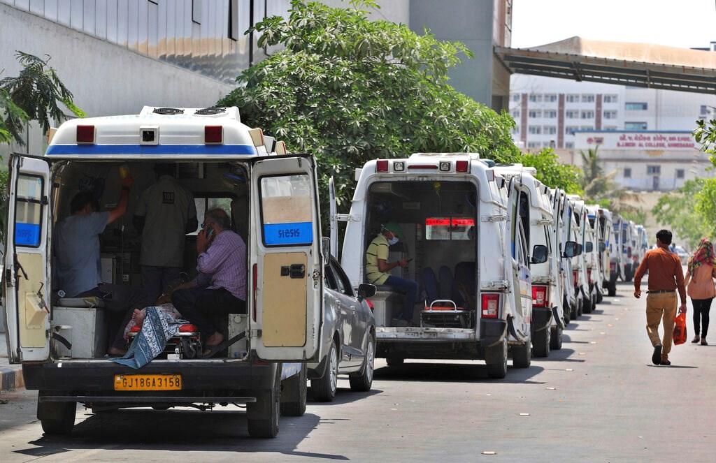Ambulances carrying COVID-19 patients line up waiting for their turn to be attended to at a dedicated COVID-19 government hospital in Ahmedabad, India, on April 22.
