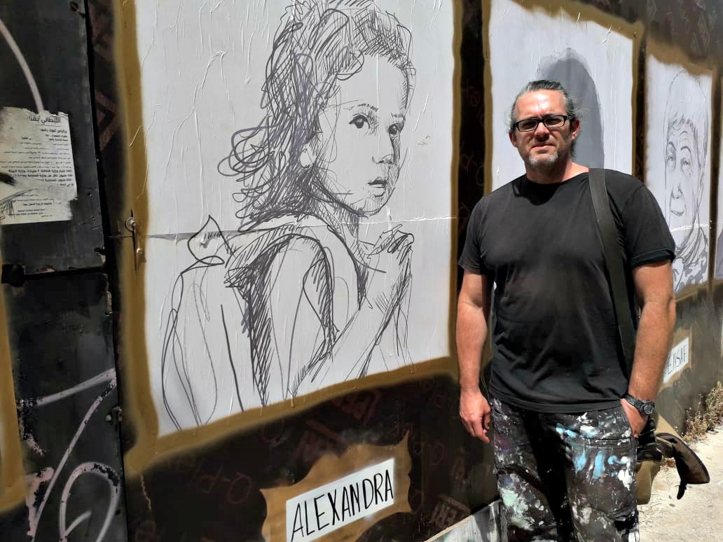 Brady Black stands in front of his #TheyMatter street art gallery in Beirut.