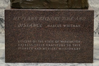 An engraving on the base of a statue of Marcus Whitman is shown in the Legislative Building at the Capitol in Olympia, Washington.