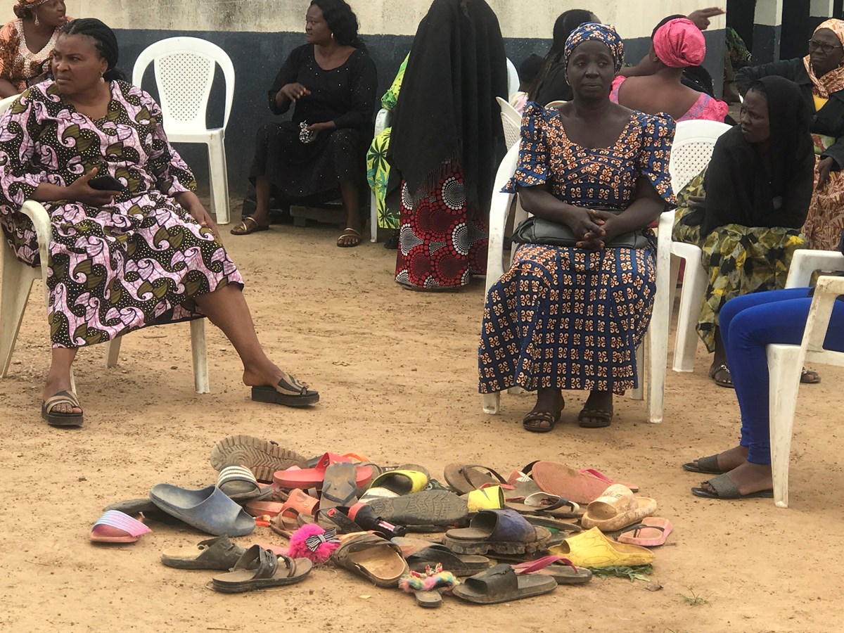 Parents wait for news by a pile of shoes left by their children abducted from Bethel Baptist High School in Damishi Kaduna, Nigeria, on July 6.