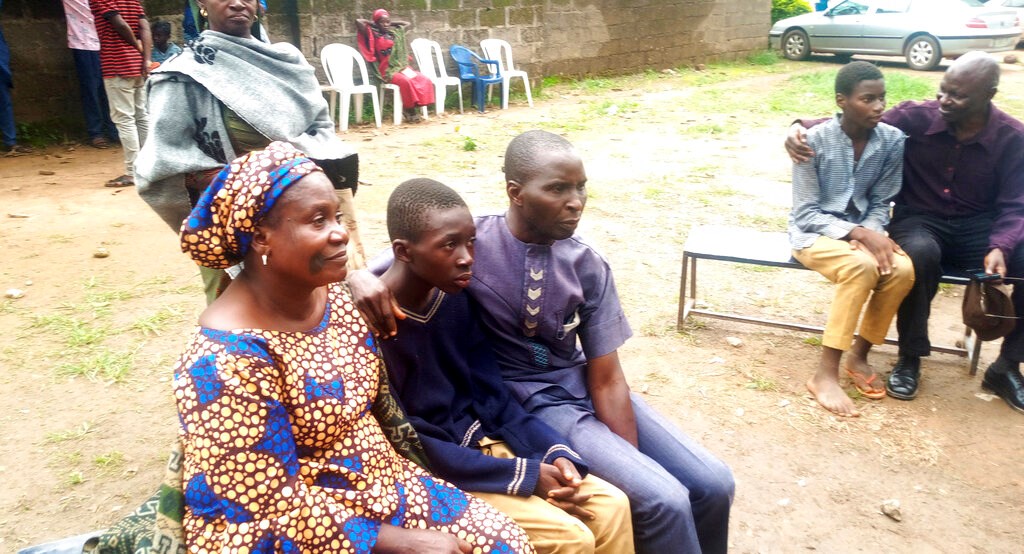 Parents are reunited with released students of the Bethel Baptist High School in Damishi, Nigeria, on Sunday, July 25.