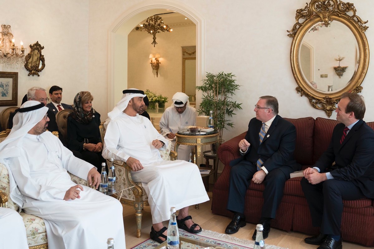 Sheikh Mohamed bin Zayed, Crown Prince of Abu Dhabi (center), welcomes a delegation of American evangelicals including Joel C. Rosenberg (left) and Johnnie Moore (right) into his home.