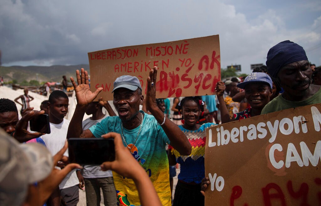 Haitians protest for the release of kidnapped missionaries near the Christian Aid Ministries headquarters in Titanyen, north of Port-au-Prince, Haiti, on Tuesday, October 19, 2021. 