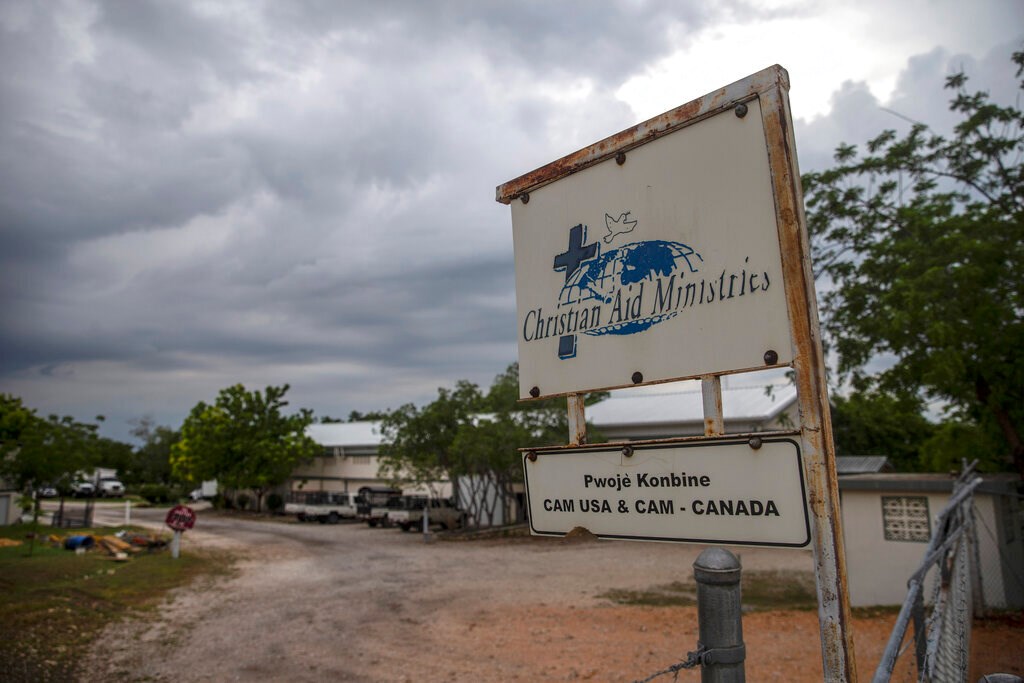 A custom sign stands outside Christian Aid Ministries in Titanyen, north of Port-au-Prince, Haiti, on Tuesday, October 19, 2021.