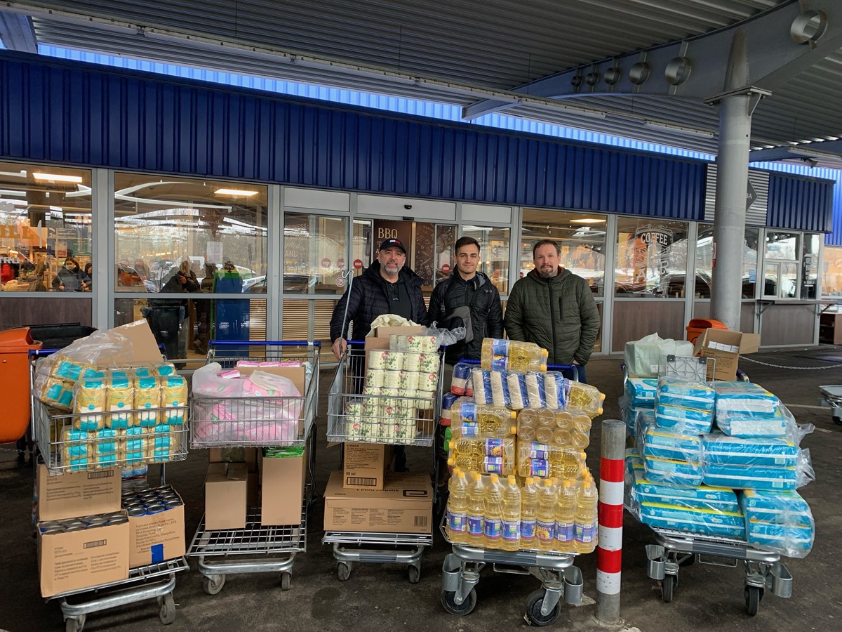 Alex Belev (left) and Eugene Solugubenco (right) shop for supplies for refugees.