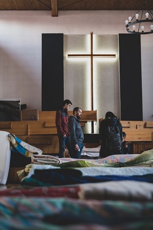 Ruslan Maliuta (right) and his son Maksym (left) visit the shelter at Chełm Baptist Church in Poland.