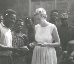Barnwell showing a booklet written in Mbembe  to speakers reading their language for the first time, 1965