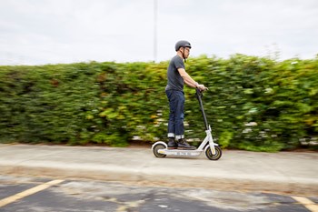 Pastor Ted of Vineyard Evanston rides to work on his electric scooter