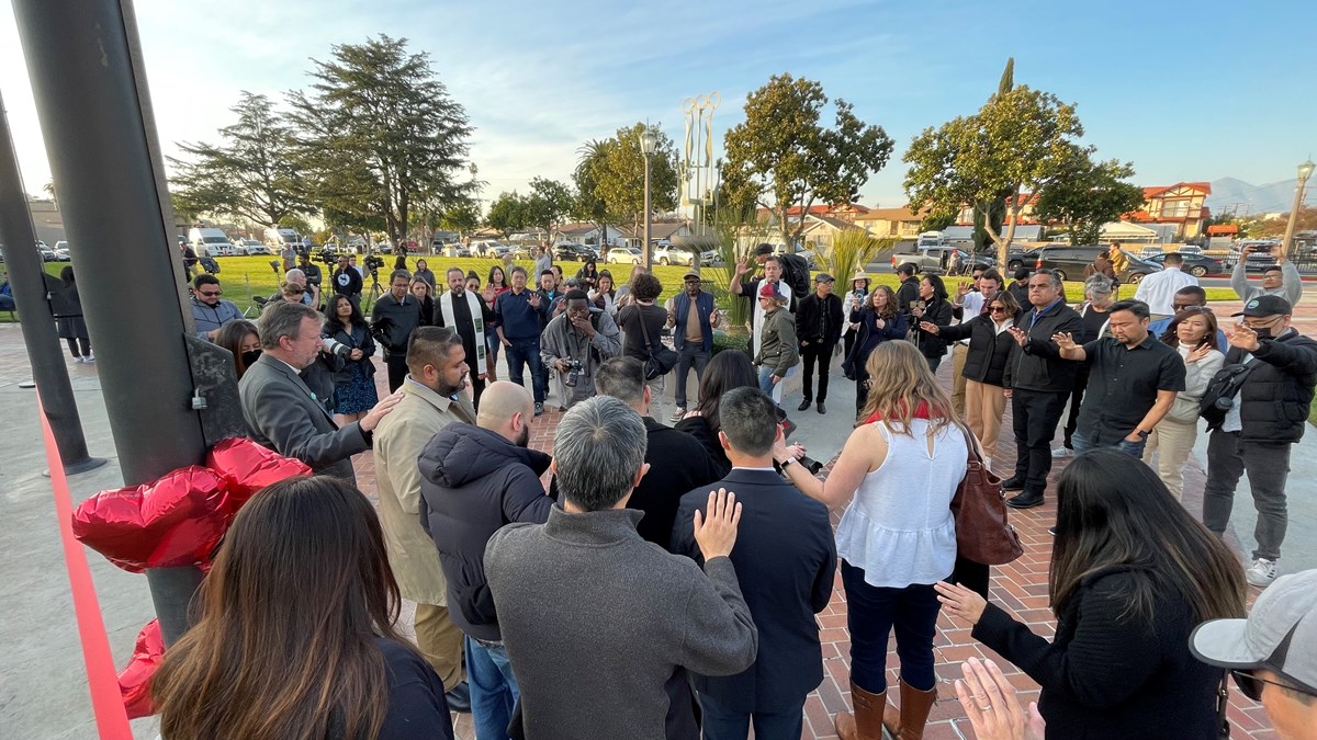 Community leaders gather for a prayer vigil. Community leaders gather for a prayer vigil.