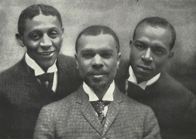 James Weldon Johnson (center) with composers Bob Cole and J. Rosamond Johnson. James Weldon Johnson (center) with composers Bob Cole and J. Rosamond Johnson.