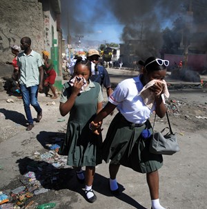 Police burn tires to protest a lack of support in their fight against gangs. 