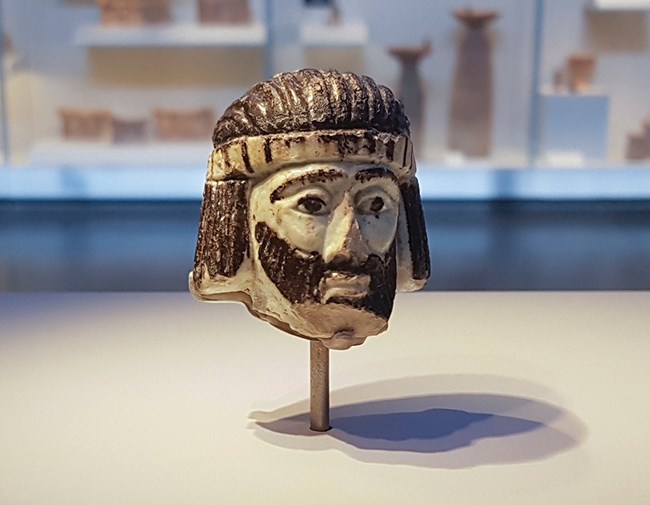 The ceramic head of a king, left in ruins a century after David’s reign.