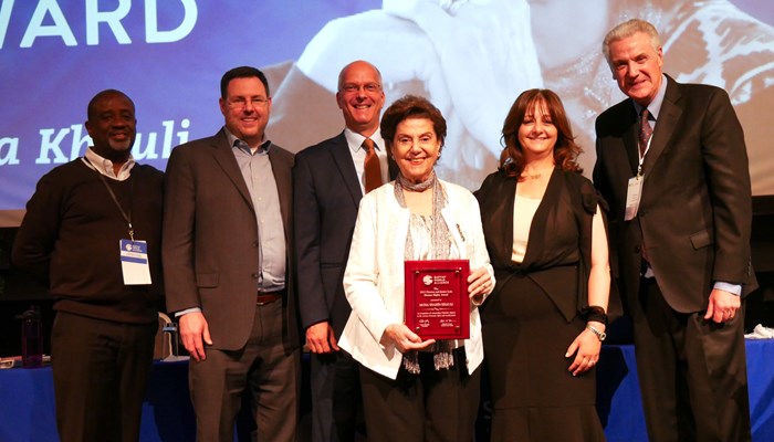 Mona Khauli (center) receiving the human rights award from Baptist World Alliance.