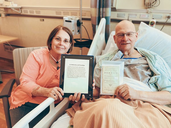 Kathy and Tim Keller receiving a gift from members of Tim’s virtual book club.