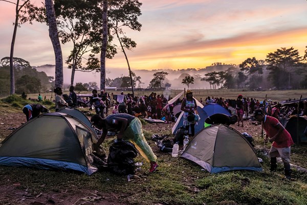 Migrants camp before trekking through the Darién Gap.