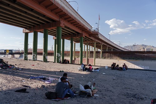 Migrants shelter beneath highway overpasses in Ciudad Juárez, waiting to cross into the United States.