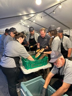 Volunteers with Texans on Mission prepare kosher meals from mobile kitchens.
