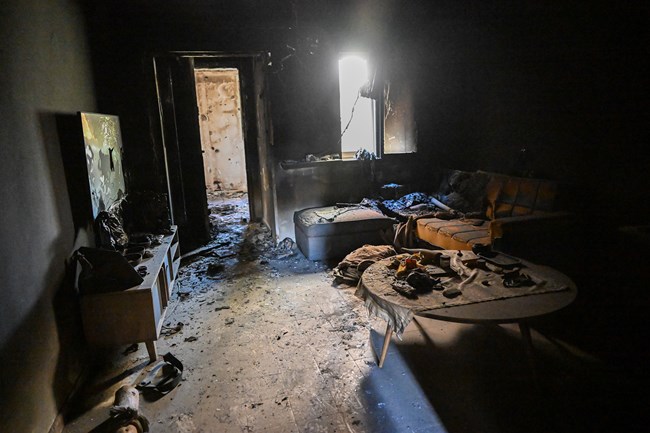 A burned home’s interior in Kfar Aza.