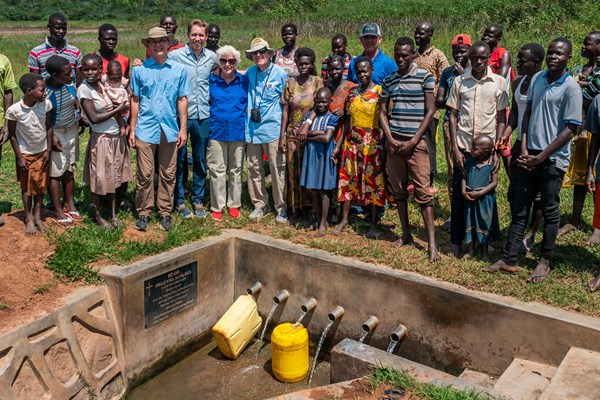 Ramon and Bob Billhimer (left center in blue) providing clean water to Uganda.