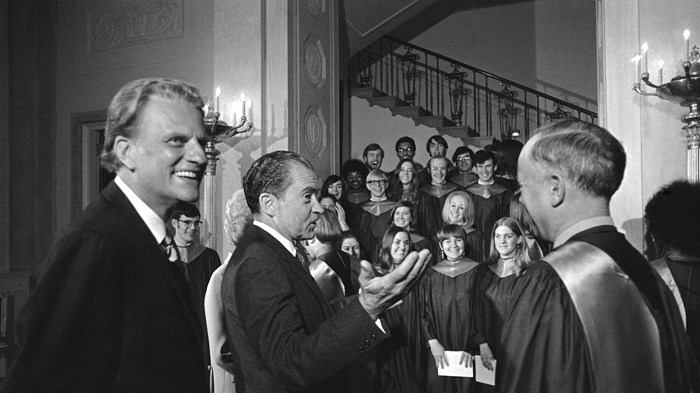 President Richard Nixon with Billy Graham (left) and choir director Allen W. Flock (right) at a church service in the White House.