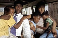 Paul Rusesabagina (Don Cheadle) and wife Tatiana (Sophie Okonedo) protect their family