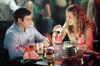 Jack and Linda Morrison (Joaquin Phoenix and Jacinda Barrett) enjoy a romantic dinner