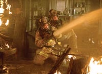 Jack and Chief Kennedy (John Travolta) fighting fires