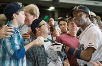 The arrogant Stan (Bernie Mac) takes a ball back from a young fan