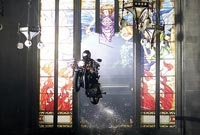 A motorcycle crashing through stained glass—now there's something you don't see every day