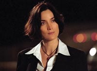 Carrie-Anne Moss plays an Agent Scully wannabe