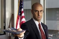 Stanley Tucci is the overzealous Homeland Security guy