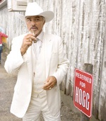 Burt Reynolds, the man in white, is Boss Hogg