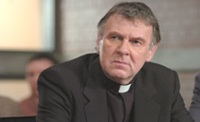 Tom Wilkinson as Father Moore, accused of killing Emily during an exorcism