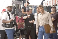 Director Cronenberg (center, blue cap) on the set with Mortensen and others