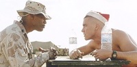 Jamie Foxx as Staff Sergeant Sykes, here with Swofford on Christmas Day
