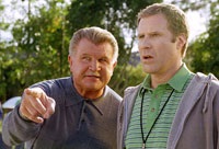 Da Coach, Mike Ditka, gives Phil a hand with the kids