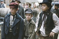 Oliver (center) and his chums Charley Bates (Lewis Chase) and the Artful Dodger (Harry Eden)