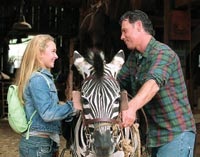 Channing and her dad (Bruce Greenwood) get Stripes ready