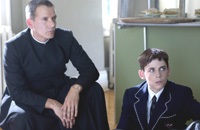 Father Hibbert (Campbell Scott) instructs Ralph on everything from religion to running
