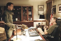 Lt. Gannon (Lucas) and Capt. Cummings (Sam Shepard) discuss EDI