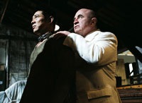 Bob Hoskins (right) is the slaveowner who treats Danny like a dog